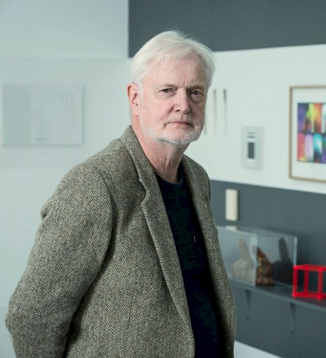 Portrait of Pétur Arason in his Reykjavik exhibition space, 2015. In the background: ", Cubit I - Selected Small Works from the collection of Pétur Arason and Ragna Róbertsdóttir". Curated by Birta Gudjonsdottir. Photo: Sigfús Már Pétursson