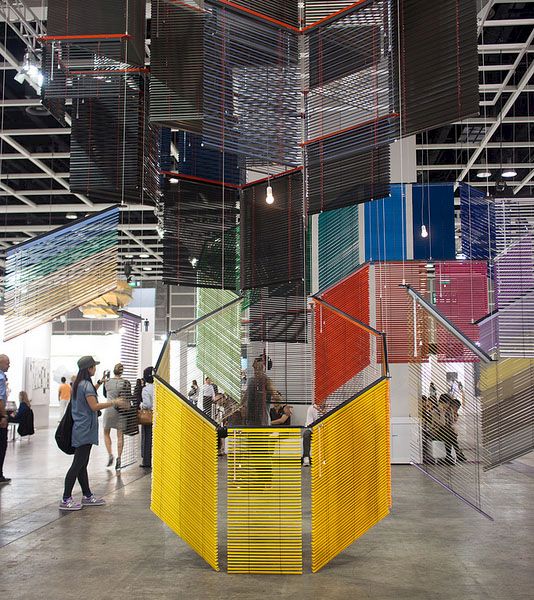 Visitors at Art Basel Hong Kong 2013 in front of a mixed media installation by Haegue Yang