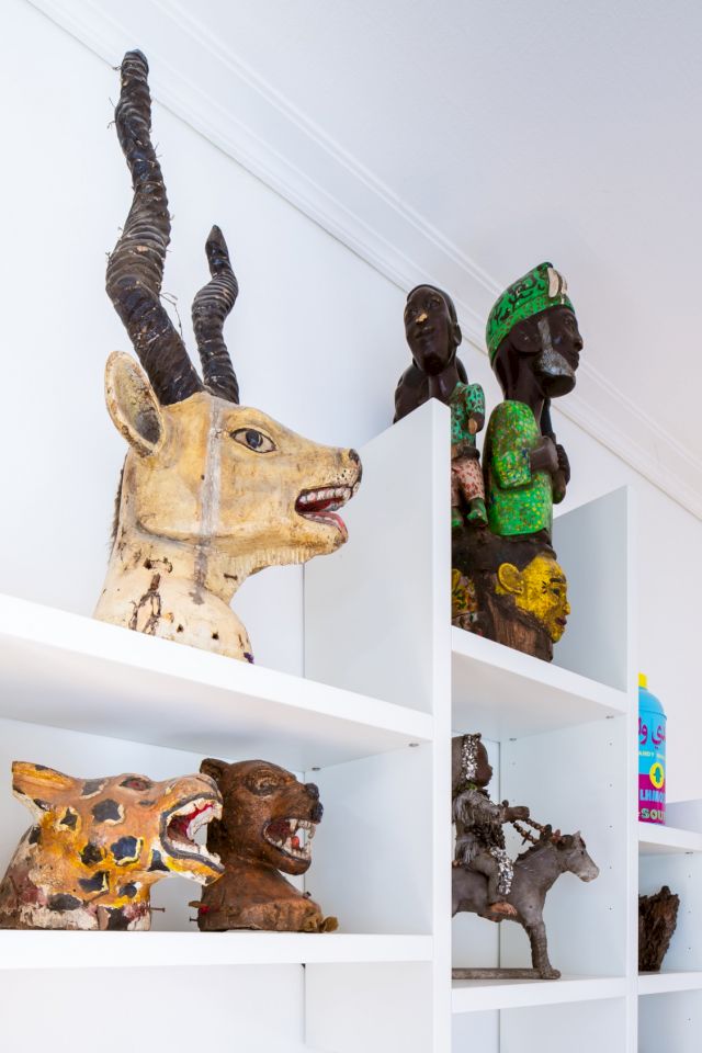 Temne masks from Sierra Leone; sculpture by Dubréus Lhérisson. Photo: Sacha Di Poi. Courtesy of Olivier Chow