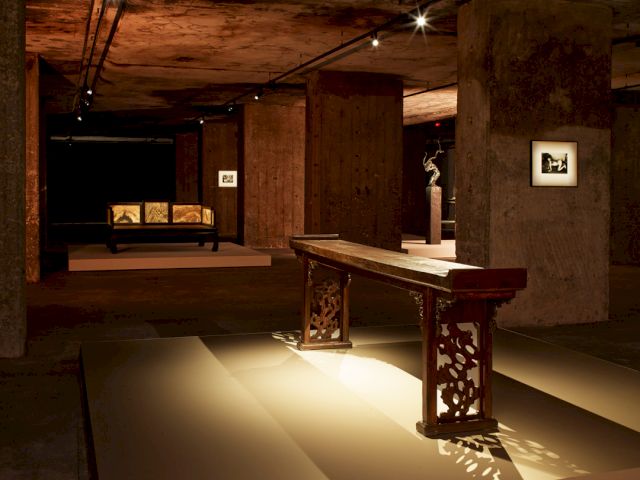 Installation view of The Feuerle Collection, Berlin. ’Side table with everted ends’, 17th Century; ’Lohan Bed’, 17th Century; Zeng Fanzhi, ’Untitled’, 2009; work by Nobuyoshi Araki. Photo: Nic Tenwiggenhorn – © VG Bild-Kunst, Bonn 2017